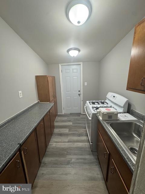 424 Cambria Street Baltimore, MD 21225 - Photo 2 of 7 a kitchen with sink and stove