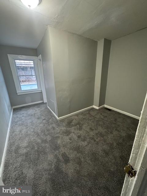 424 Cambria Street Baltimore, MD 21225 - Photo 5 of 7 an empty room with windows