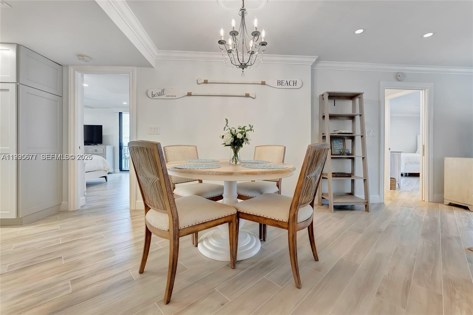 400 Ocean Trail Way, Unit 401 Jupiter, FL 33477 - Photo 17 of 28 a view of a dining room with furniture and wooden floor