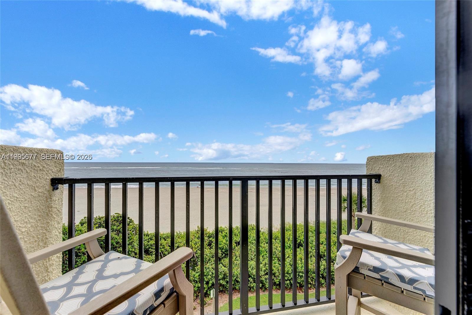 400 Ocean Trail Way, Unit 401 Jupiter, FL 33477 - Photo 4 of 28 a view of a balcony with wooden fence