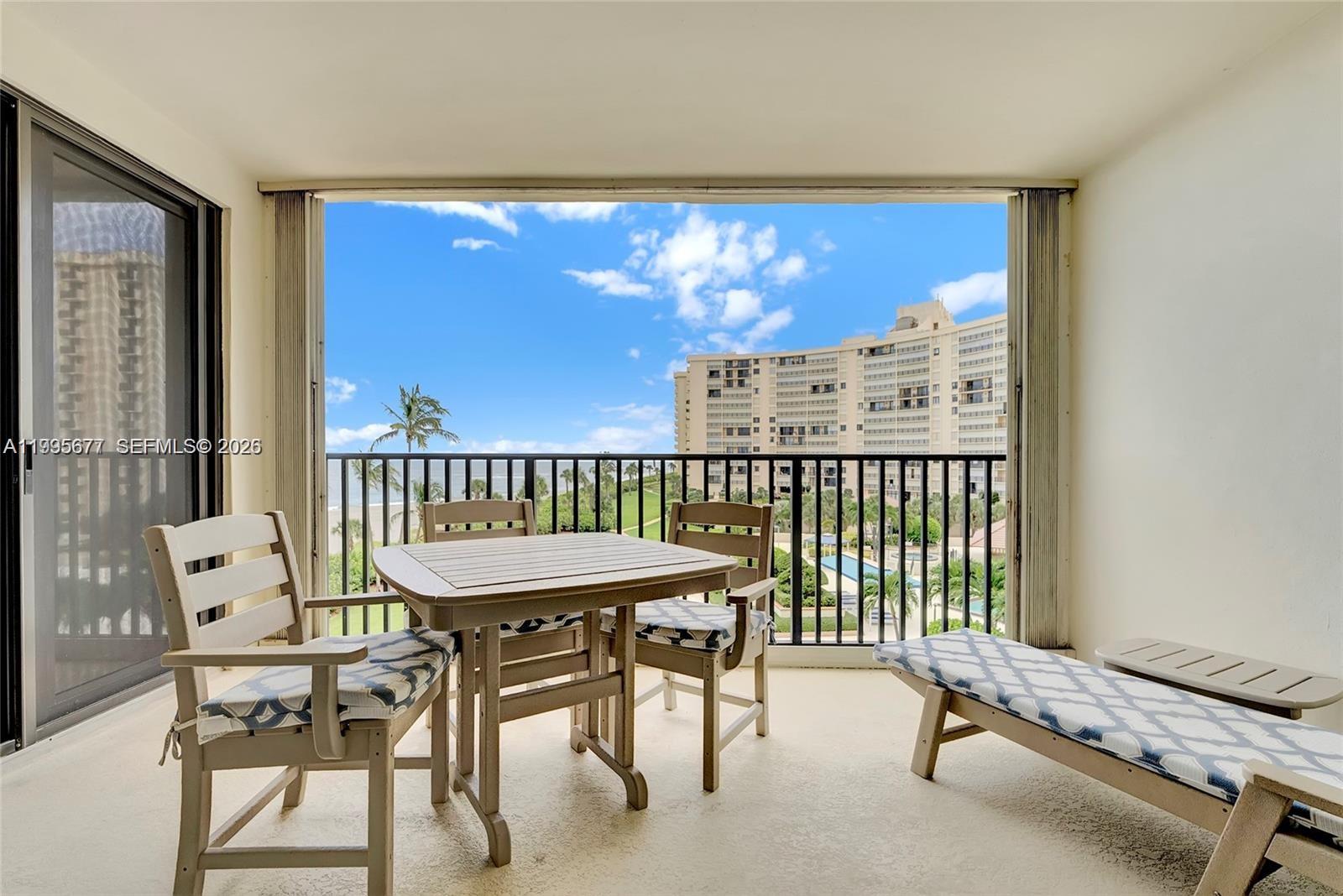 400 Ocean Trail Way, Unit 401 Jupiter, FL 33477 - Photo 5 of 28 a room with furniture and a window