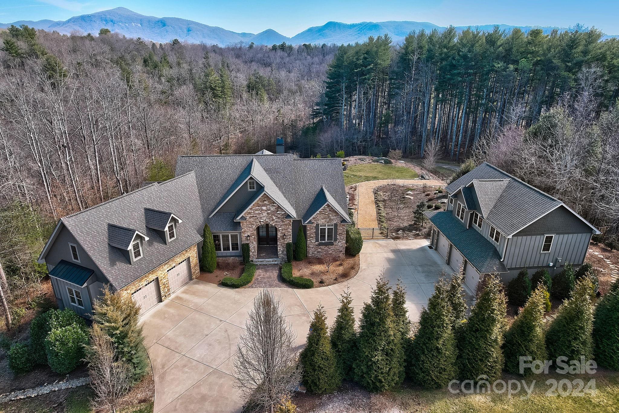 an aerial view of a house with mountain view