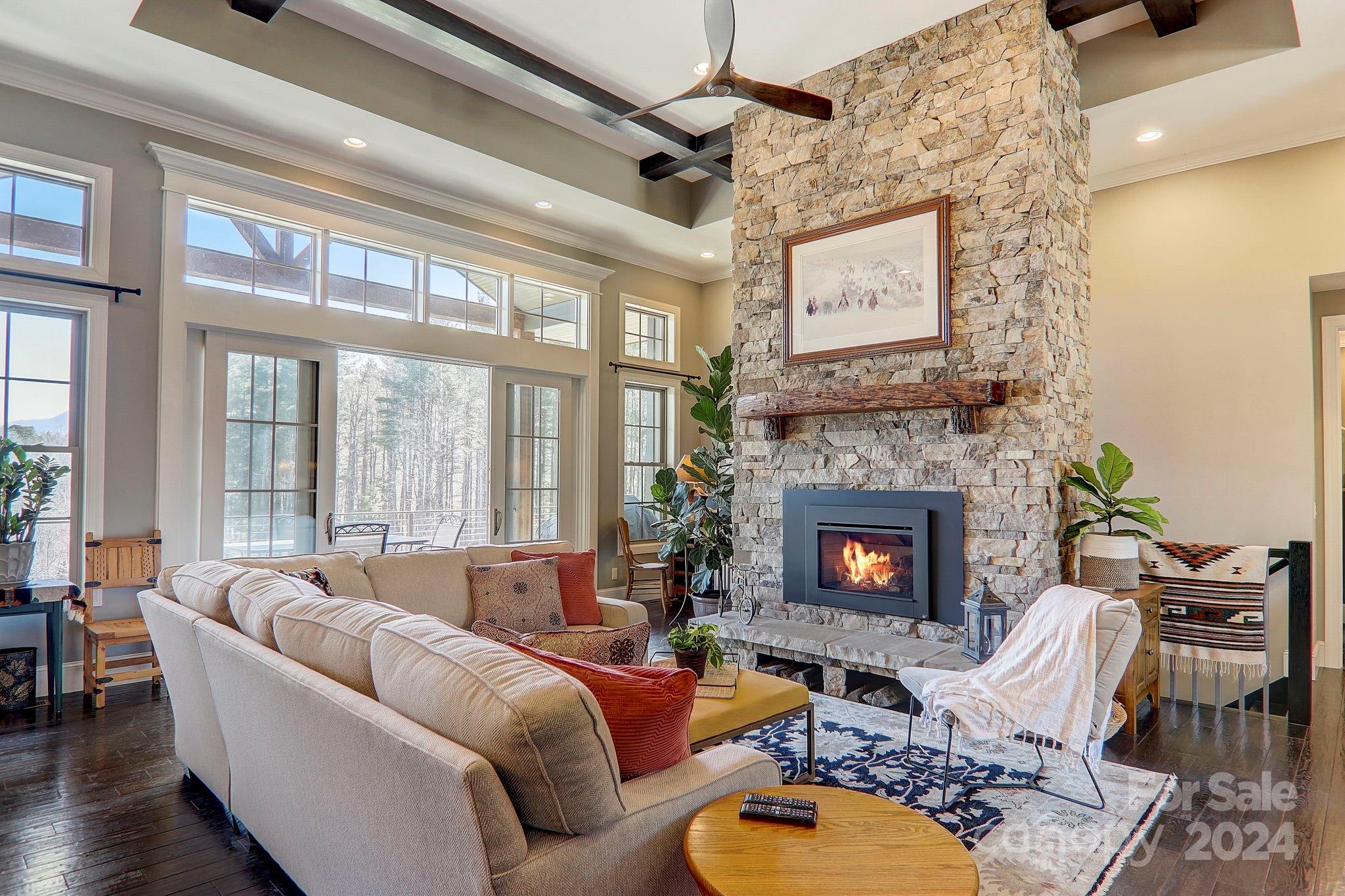 34 Ledgestone Drive Fairview, NC 28730 - Photo 16 of 47 a living room with furniture fireplace and a large window