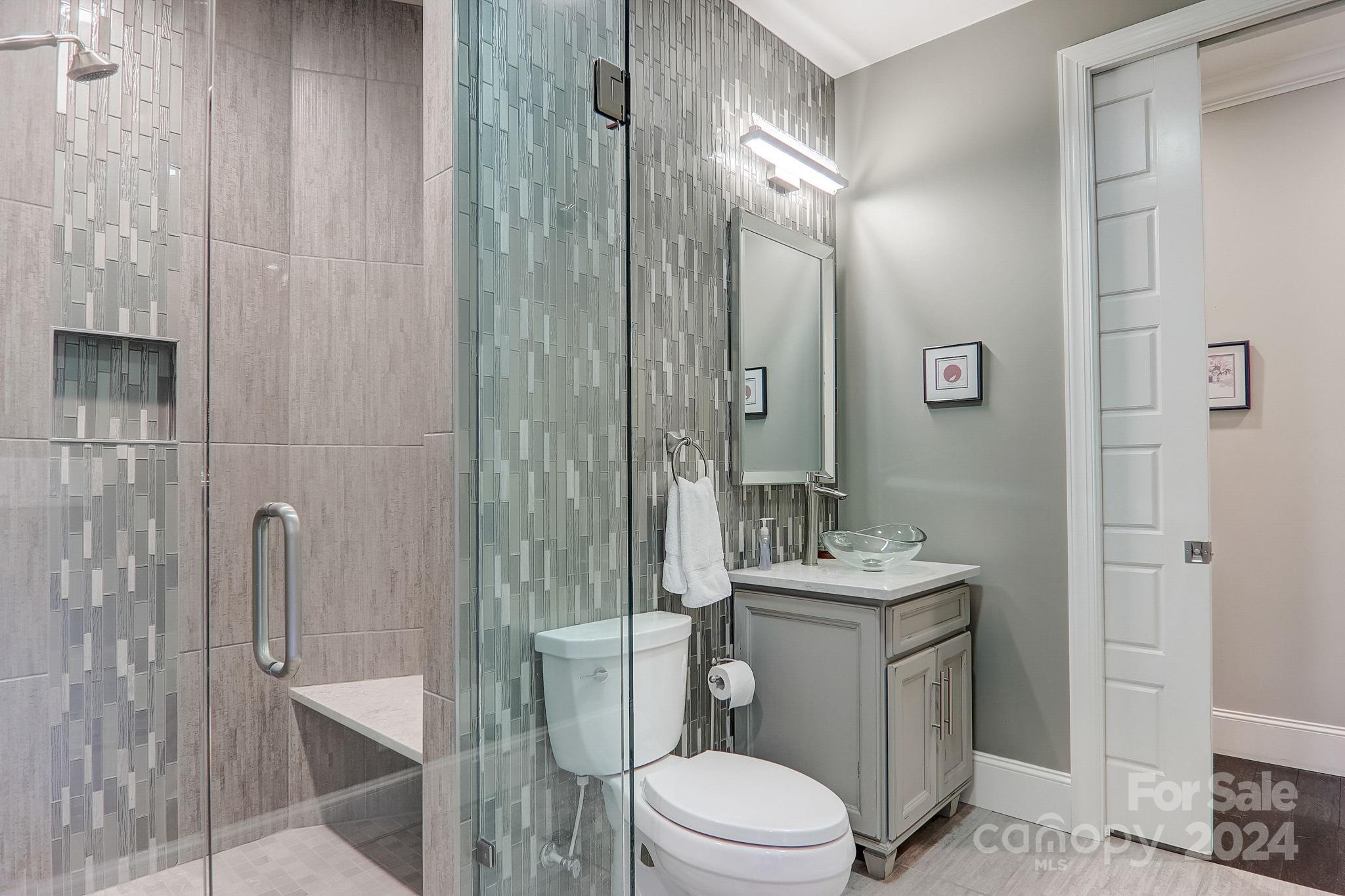 34 Ledgestone Drive Fairview, NC 28730 - Photo 24 of 47 a bathroom with a granite countertop sink toilet and shower
