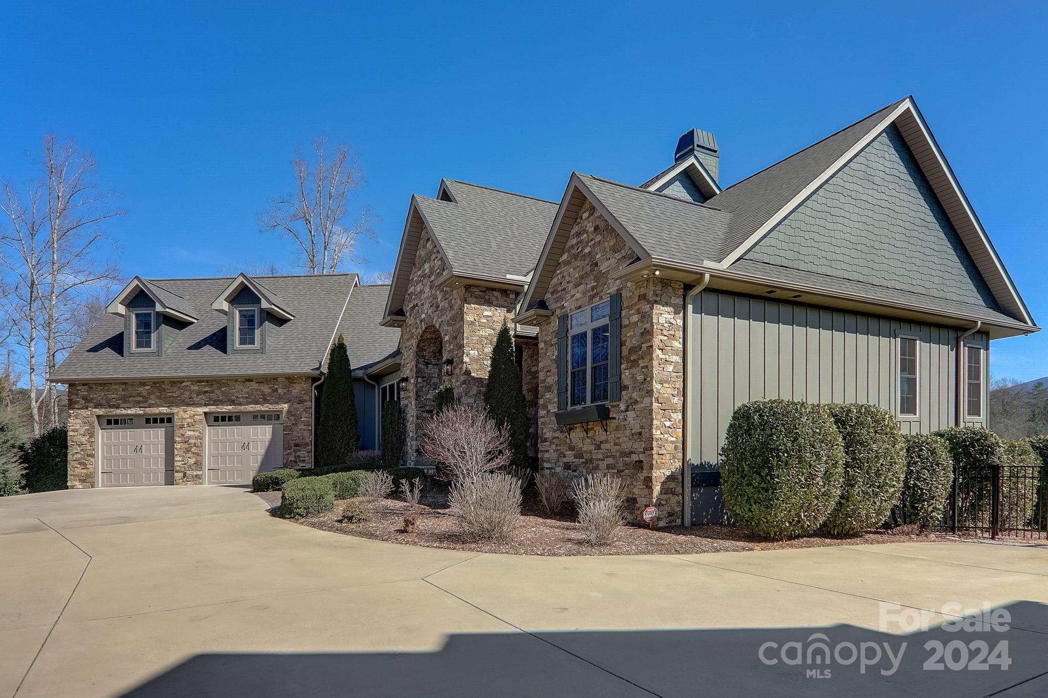 34 Ledgestone Drive Fairview, NC 28730 - Photo 3 of 47 a front view of a house with garden