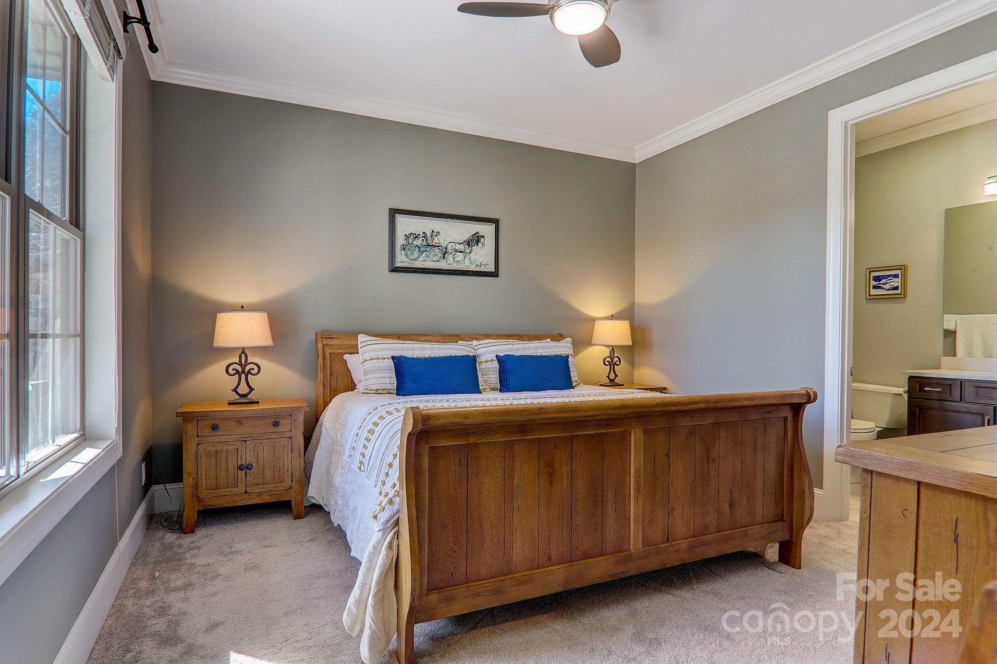 34 Ledgestone Drive Fairview, NC 28730 - Photo 33 of 47 a bedroom with a bed and a cabinets