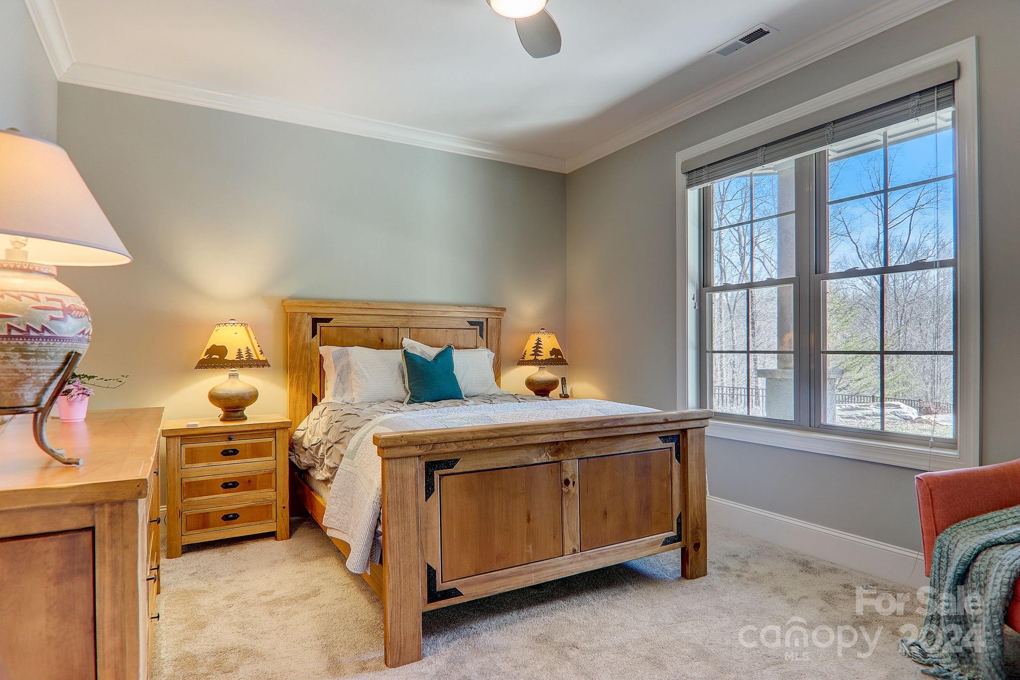 34 Ledgestone Drive Fairview, NC 28730 - Photo 34 of 47 a bed sitting in a bedroom next to a window