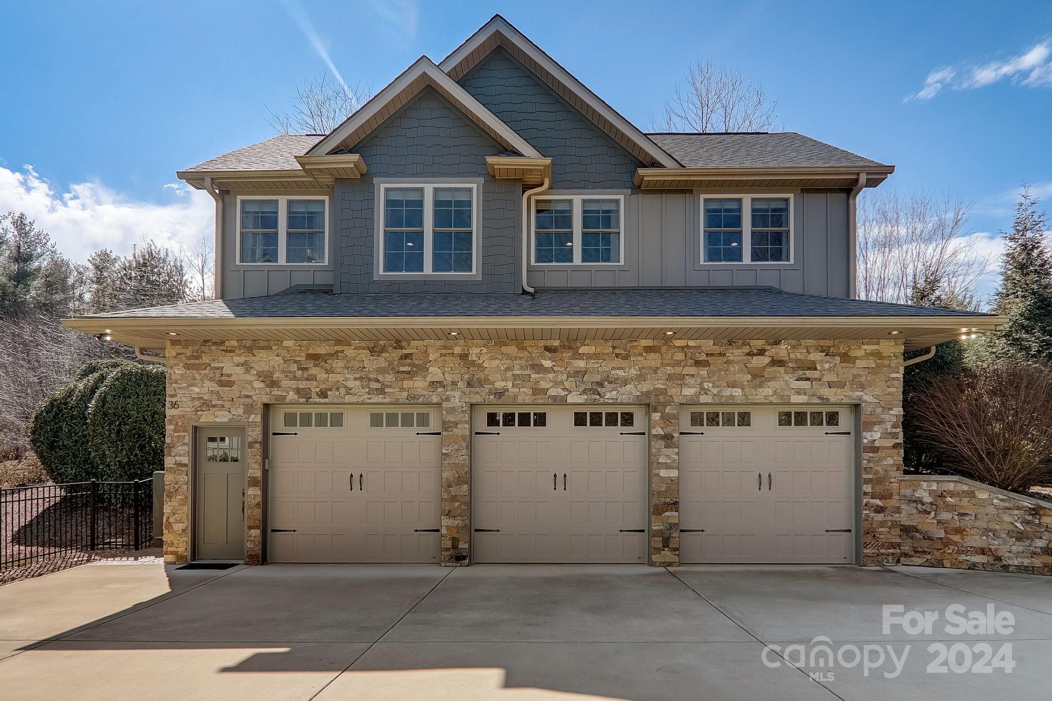 34 Ledgestone Drive Fairview, NC 28730 - Photo 38 of 47 a front view of a house with garden