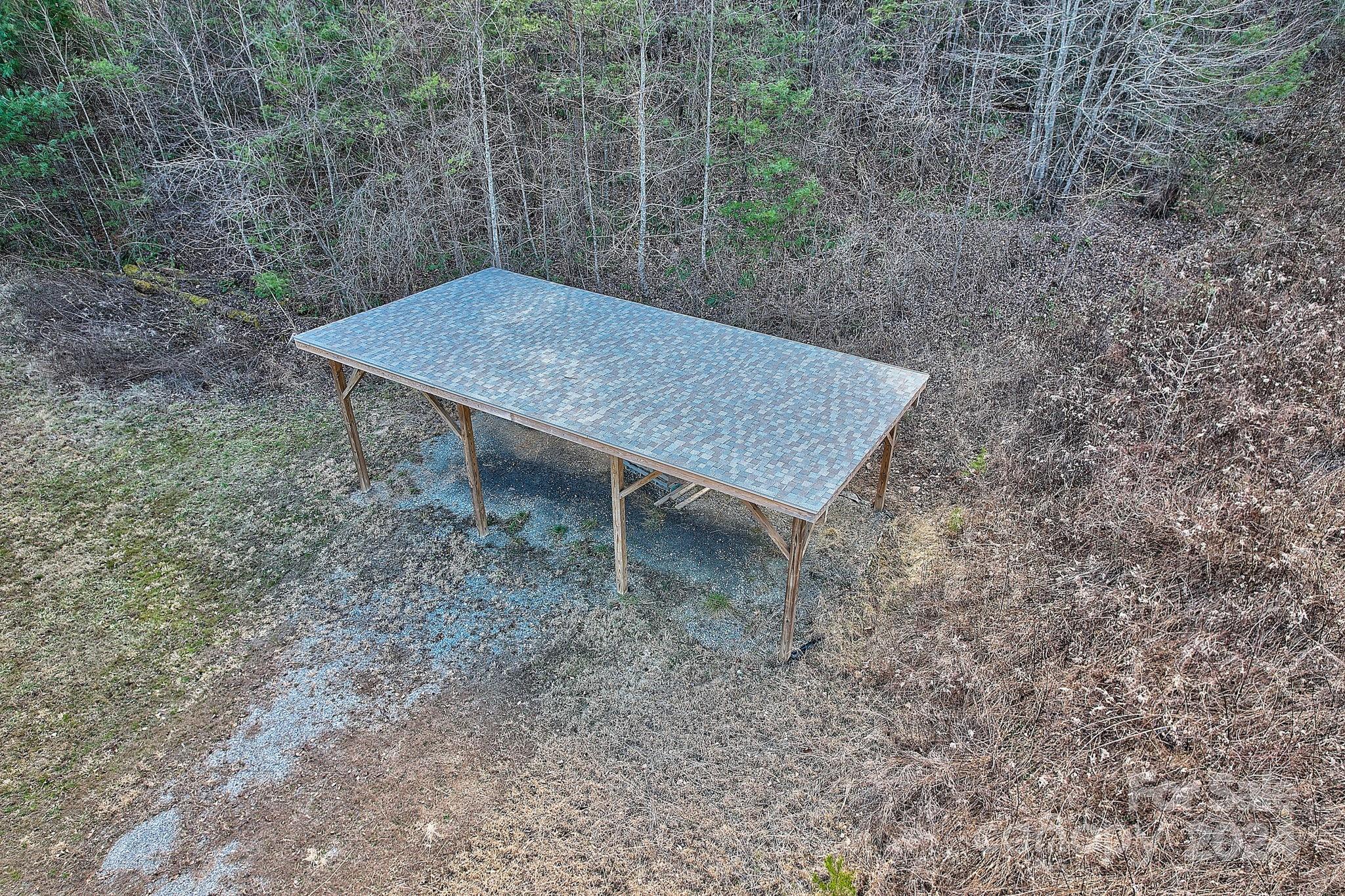 34 Ledgestone Drive Fairview, NC 28730 - Photo 46 of 47 a view of a backyard with a table and chairs