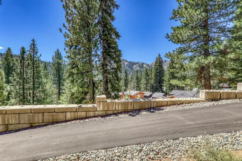 a view of a back yard of the house and trees