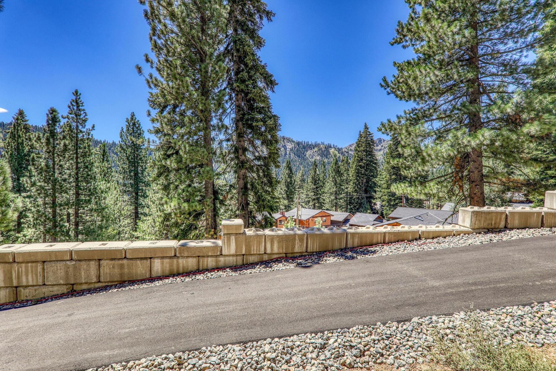 1060 Sandy Way Olympic Valley, CA 96146 - Photo 10 of 14 a view of a back yard of the house and trees