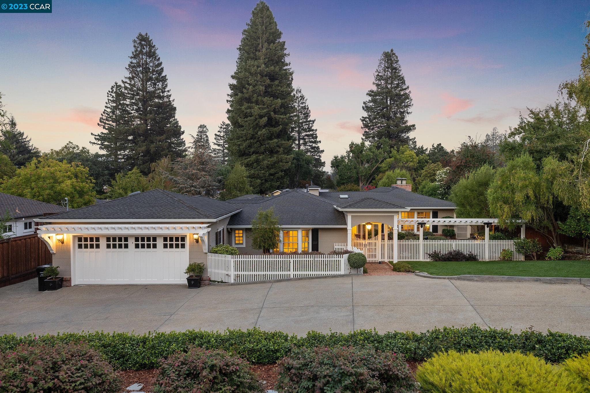 22 Hidden Valley Road Lafayette, CA 94549 - Photo 1 of 1 a front view of a house with a yard and garage