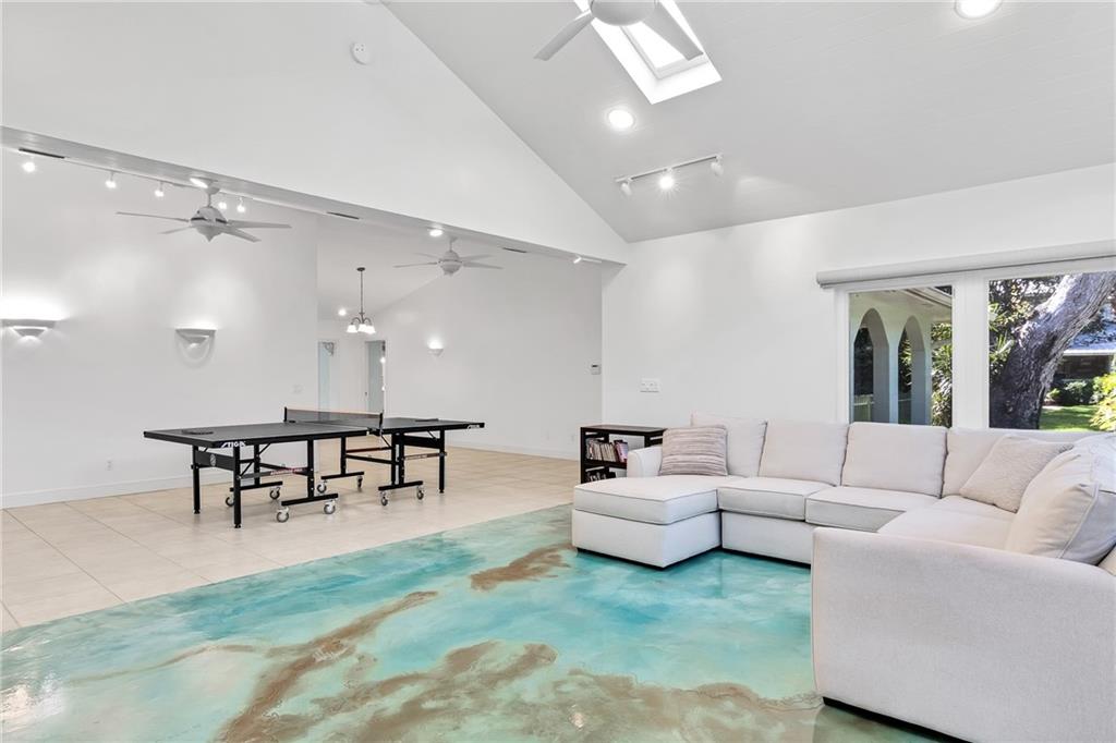 2075 Spring Place Vero Beach, FL 32963 - Photo 16 of 36 a living room with furniture wooden floor and a table