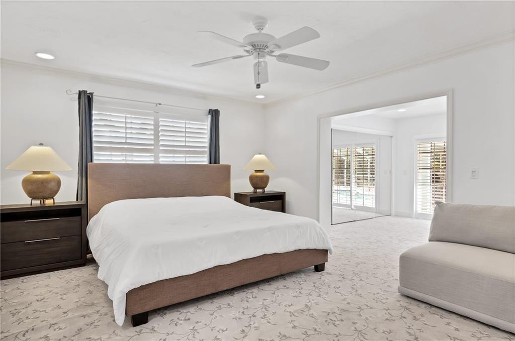 2075 Spring Place Vero Beach, FL 32963 - Photo 18 of 36 a bedroom with a bed and window