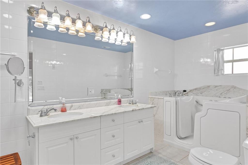 2075 Spring Place Vero Beach, FL 32963 - Photo 20 of 36 a bathroom with a sink double vanity and a mirror