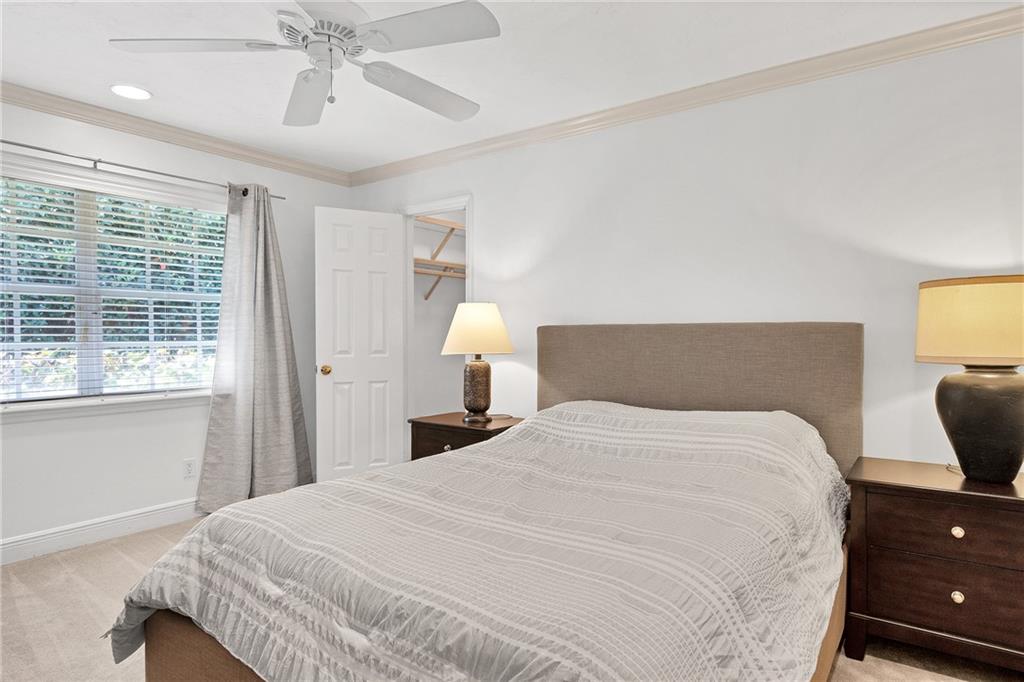 2075 Spring Place Vero Beach, FL 32963 - Photo 22 of 36 a bedroom with a bed and a chandelier