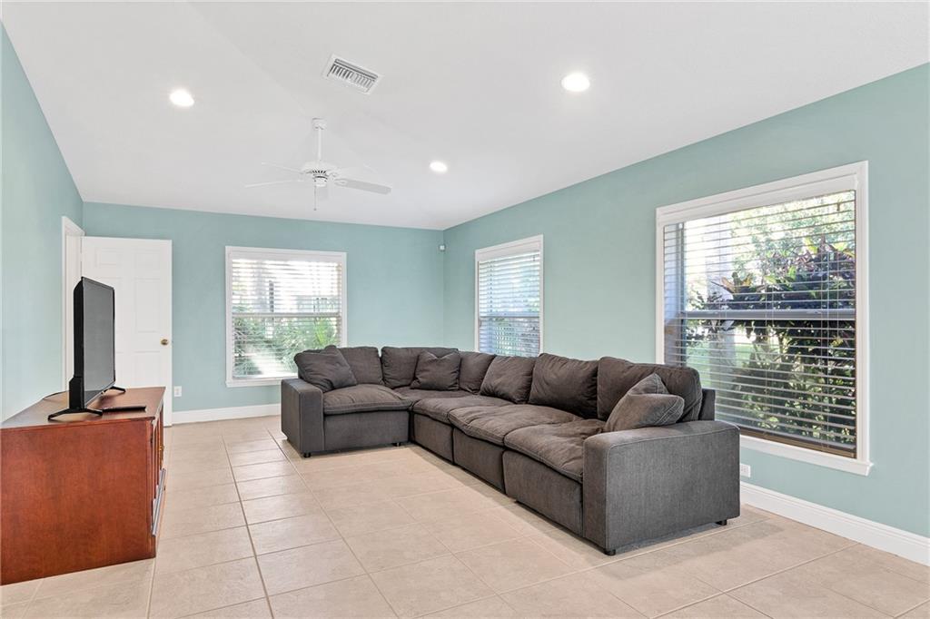 2075 Spring Place Vero Beach, FL 32963 - Photo 25 of 36 a living room with furniture and a flat screen tv