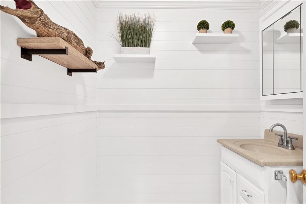 2075 Spring Place Vero Beach, FL 32963 - Photo 29 of 36 a bathroom with a sink and mirror