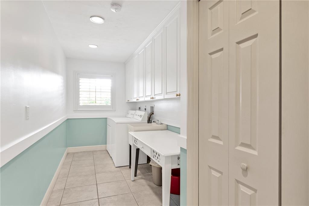 2075 Spring Place Vero Beach, FL 32963 - Photo 30 of 36 a bathroom with a sink a toilet and a window