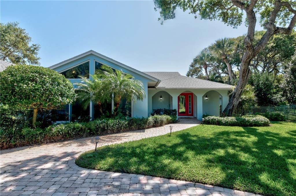 2075 Spring Place Vero Beach, FL 32963 - Photo 3 of 36 a front view of house with yard and green space