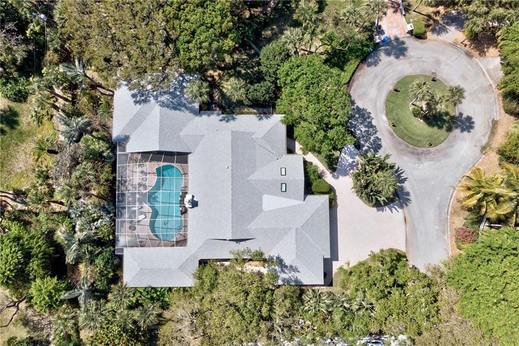 2075 Spring Place Vero Beach, FL 32963 - Photo 36 of 36 an aerial view of a house with a yard and garden