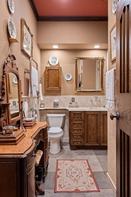 114 Lees Lake Road Fayetteville, GA 30214 - Photo 40 of 67 a bathroom with a sink a toilet and mirror