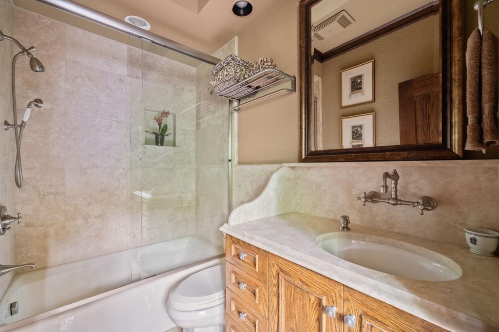 114 Lees Lake Road Fayetteville, GA 30214 - Photo 44 of 67 a bathroom with a granite countertop sink a toilet and shower