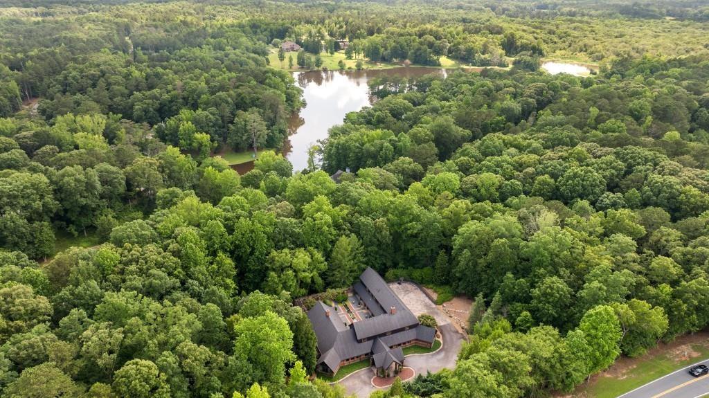 114 Lees Lake Road Fayetteville, GA 30214 - Photo 51 of 67 an aerial view of a house with a yard