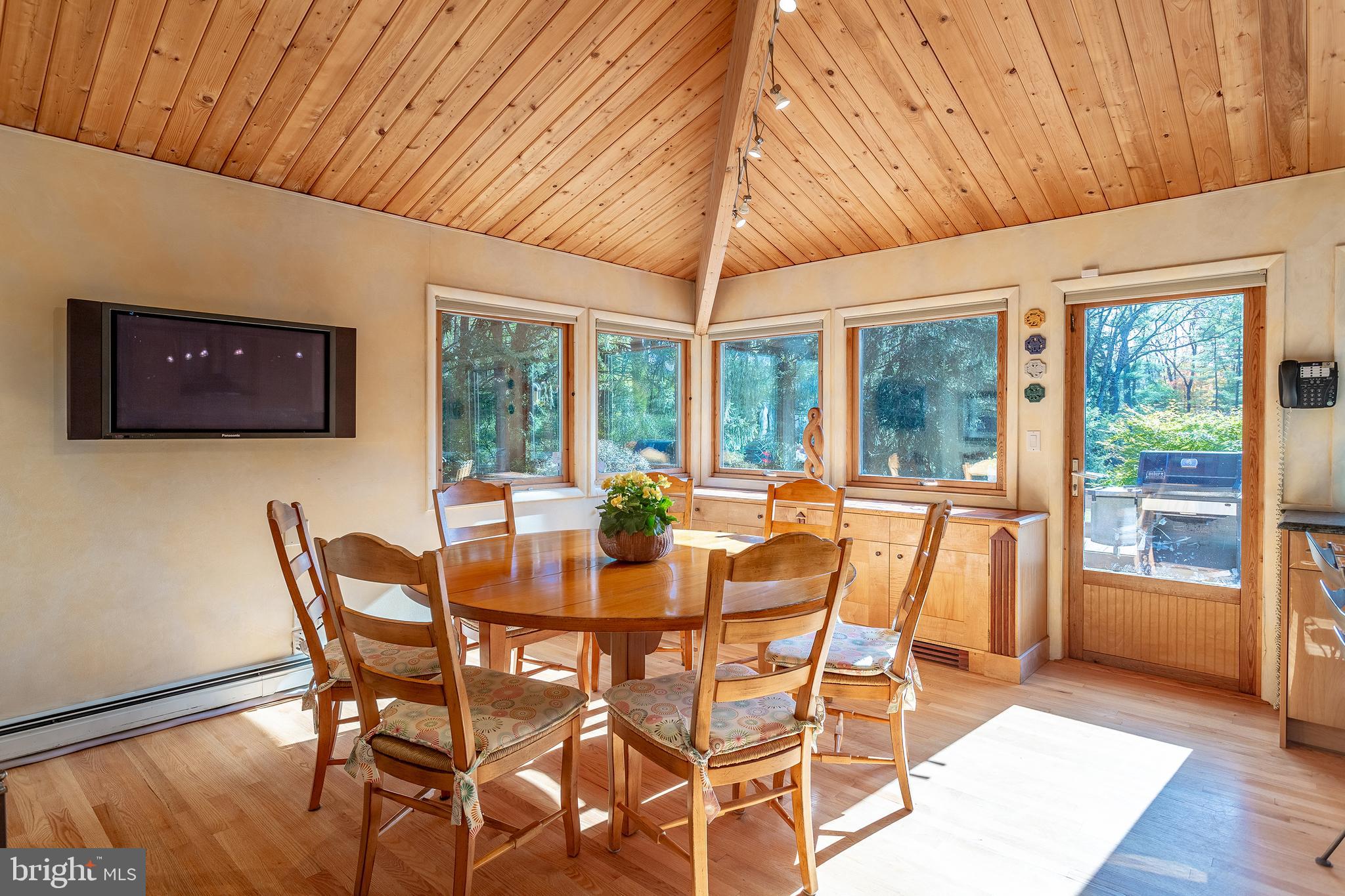 2626 Aquetong Road New Hope, PA 18938 - Photo 7 of 27 a dining room with furniture and wooden floor