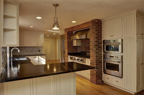 68 Boren Lane Boxford, MA 01921 - Photo 8 of 28 a kitchen with stainless steel appliances granite countertop a sink a stove and a refrigerator