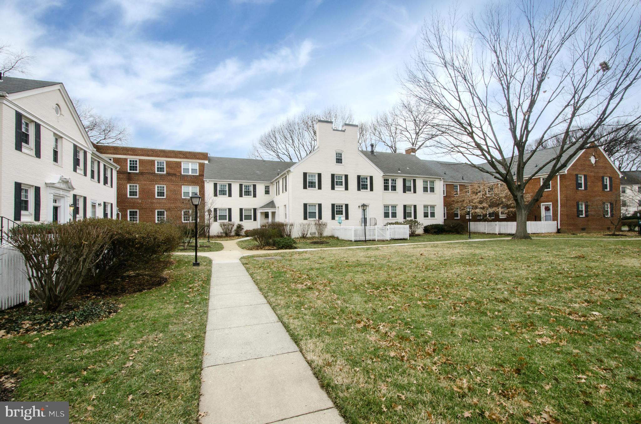 2912 13th Road South, Unit 204 Arlington, VA 22204 - Photo 1 of 13 a front view of a house with a garden
