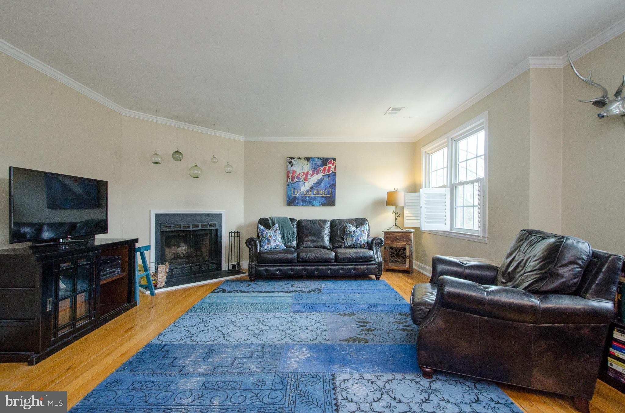 2912 13th Road South, Unit 204 Arlington, VA 22204 - Photo 2 of 13 a living room with furniture and a flat screen tv
