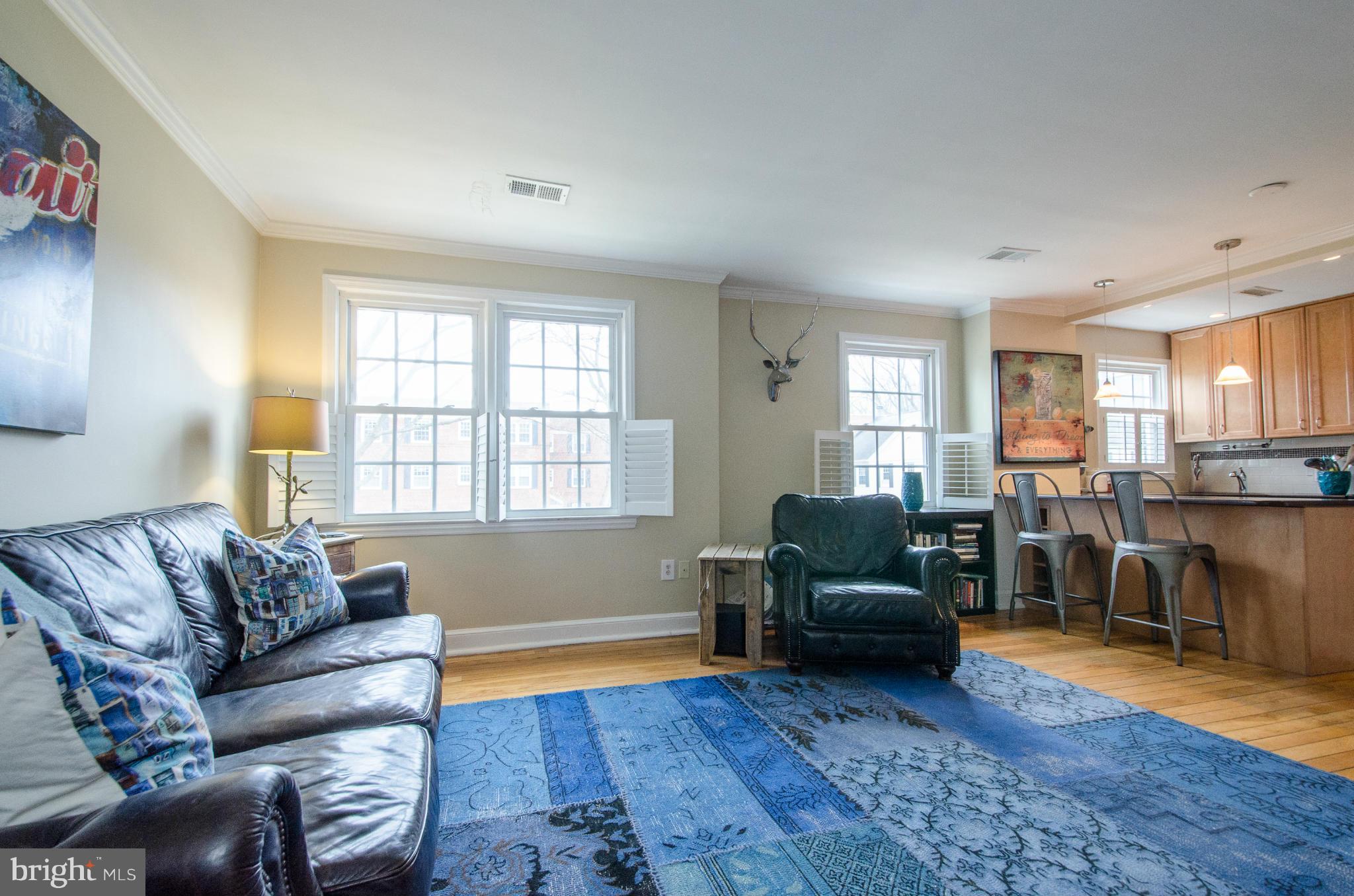 2912 13th Road South, Unit 204 Arlington, VA 22204 - Photo 5 of 13 a living room with furniture and a wooden floor