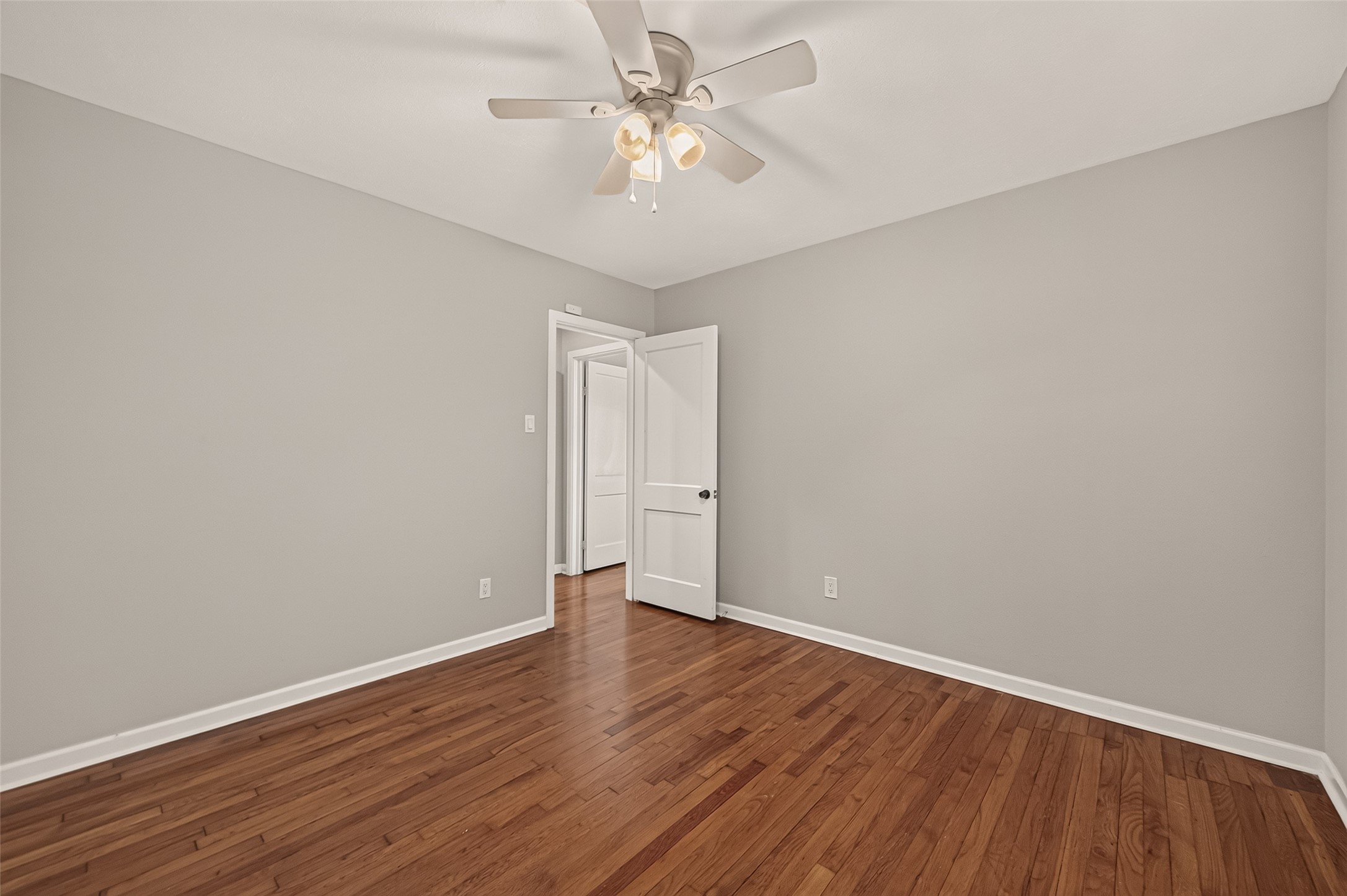 2019 Gostick Street Houston, TX 77008 - Photo 29 of 36 a view of an empty room with window and wooden floor