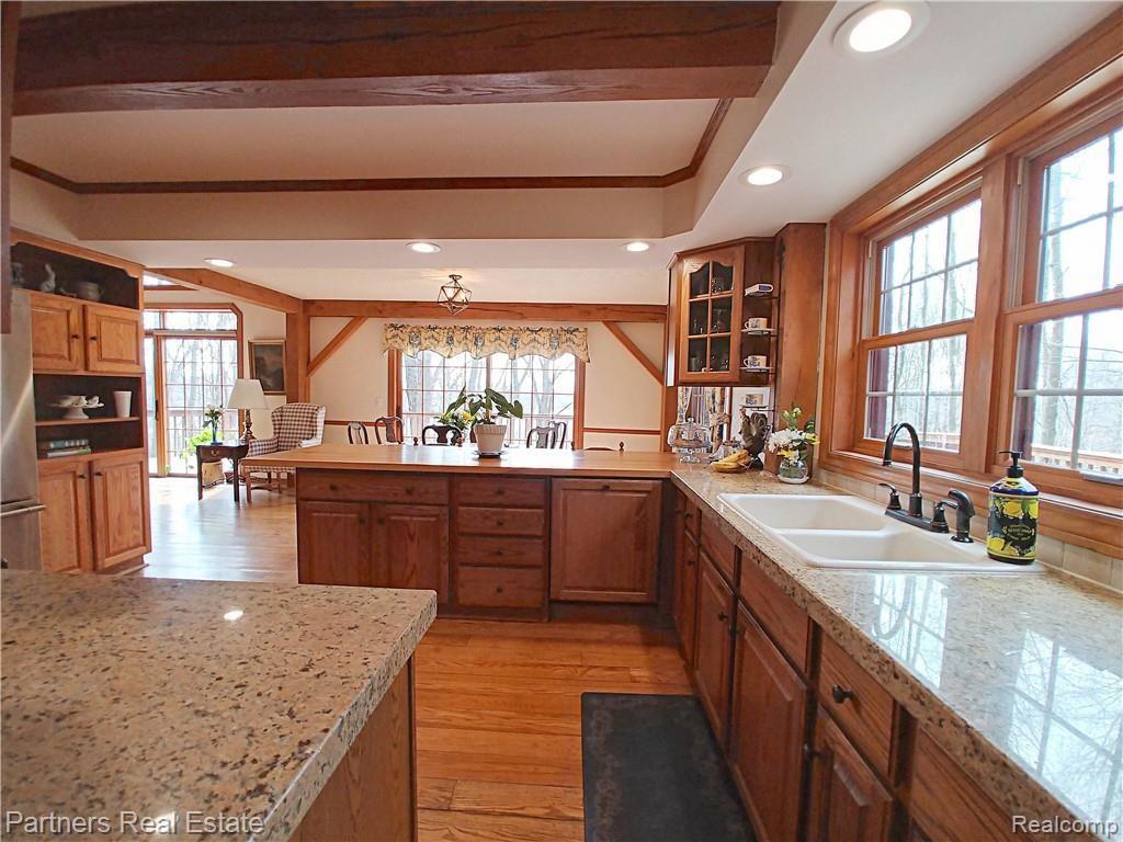 2715 West Coon Lake Road Howell, MI 48843 - Photo 17 of 54 6b. Home's Ambience Felt from Every Angle of the Masterful Design