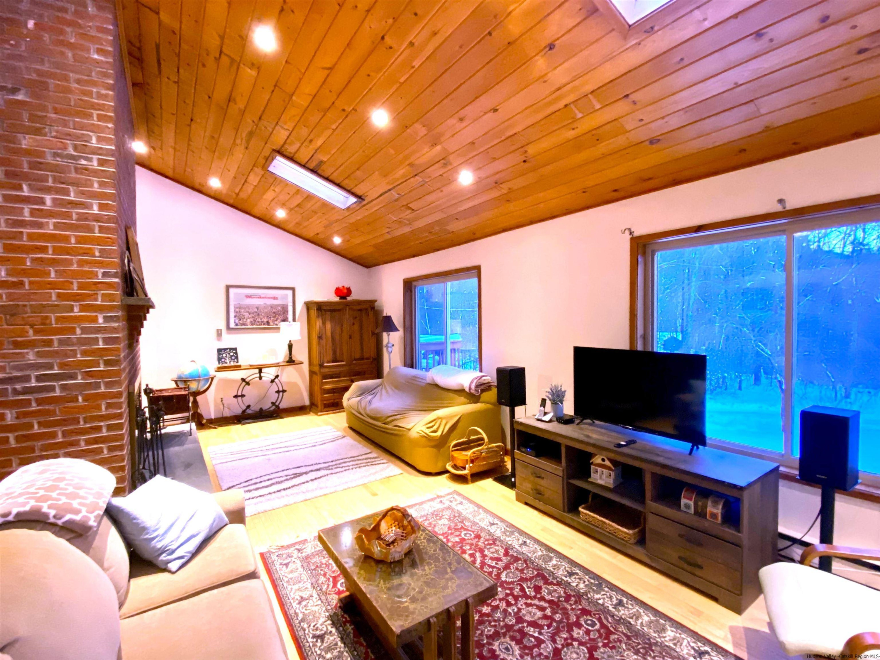 295 Grog Kill Road Willow, NY 12495 - Photo 2 of 14 a living room with furniture and a flat screen tv