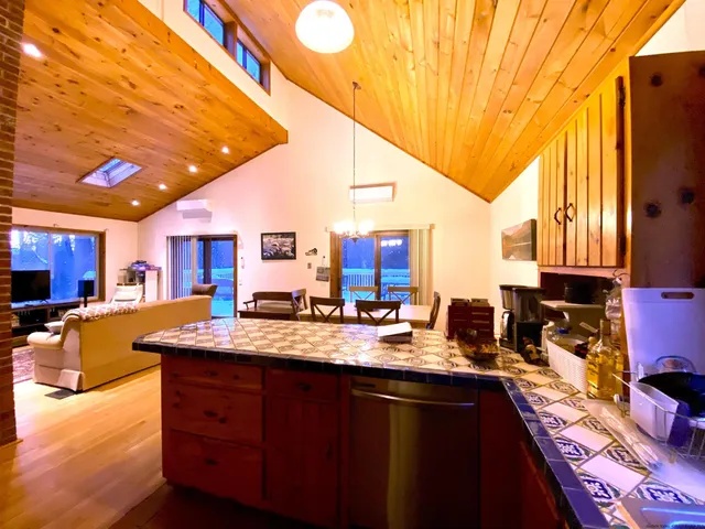 a kitchen with sink and cabinets
