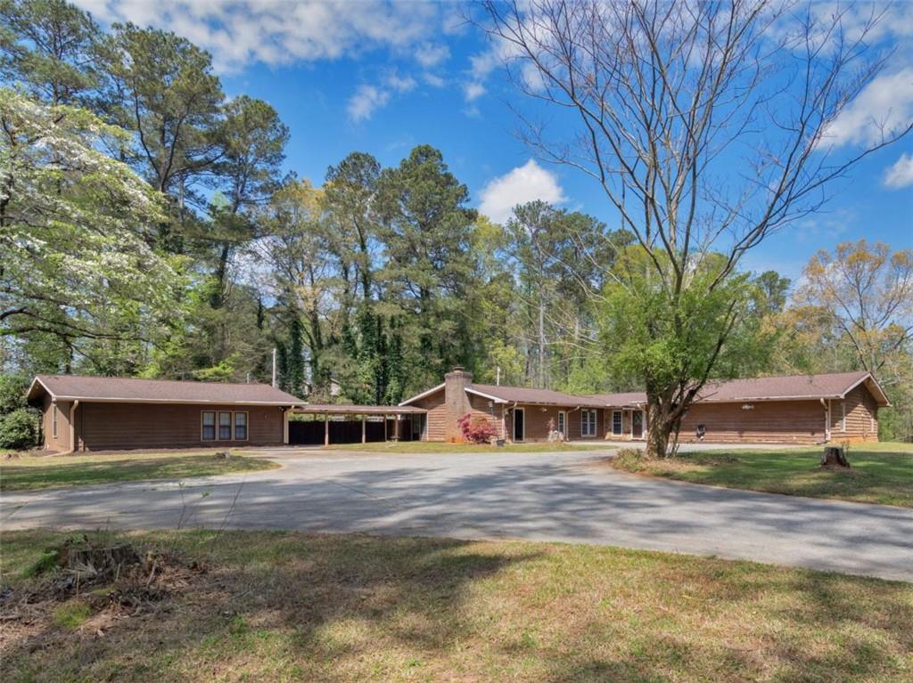 3236 Boulder Drive Southwest Stockbridge, GA 30281 - Photo 1 of 1 a front view of a house with garden