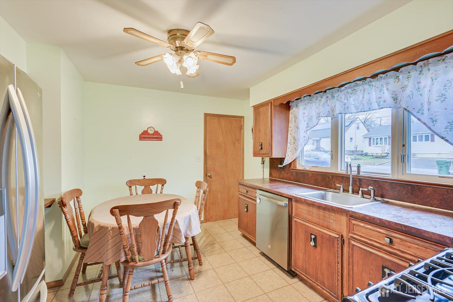 65 Rose Street Edison, NJ 08817 - Photo 13 of 35 a kitchen with a sink and cabinets