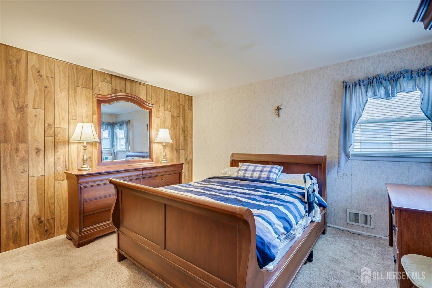 65 Rose Street Edison, NJ 08817 - Photo 17 of 35 a bedroom with a bed and a window