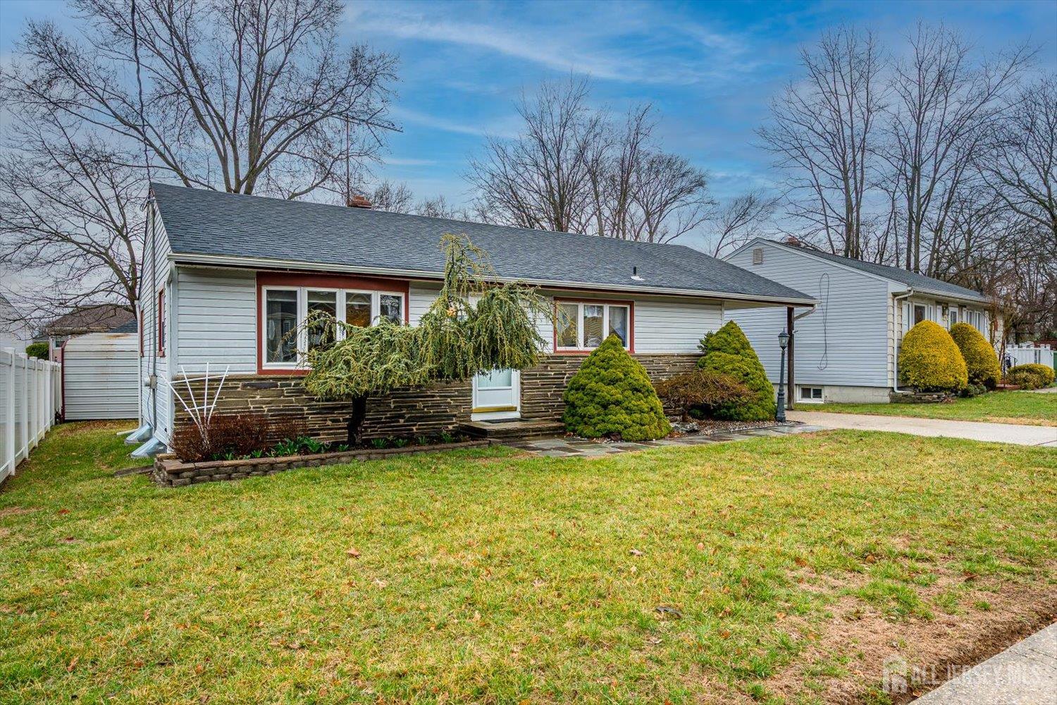 65 Rose Street Edison, NJ 08817 - Photo 2 of 35 a front view of a house with garden