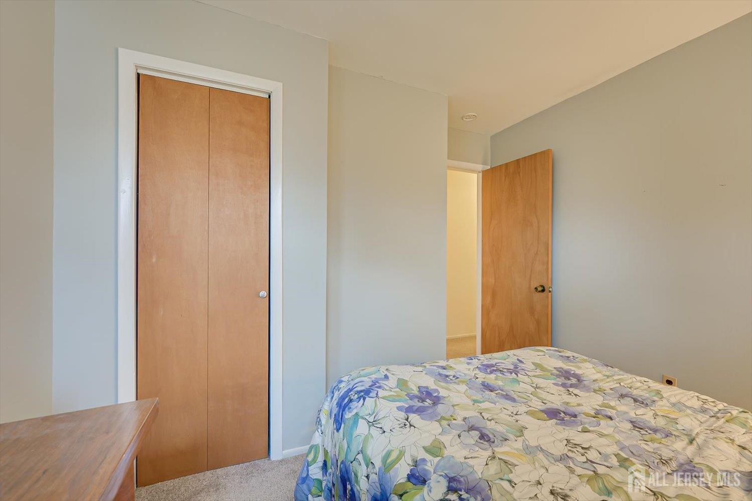 65 Rose Street Edison, NJ 08817 - Photo 21 of 35 a bedroom with a bed and wooden floor
