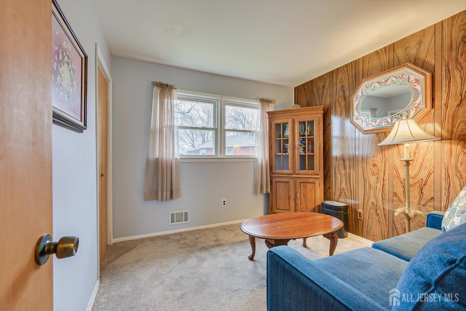 65 Rose Street Edison, NJ 08817 - Photo 22 of 35 a bedroom with a bed and a table in it