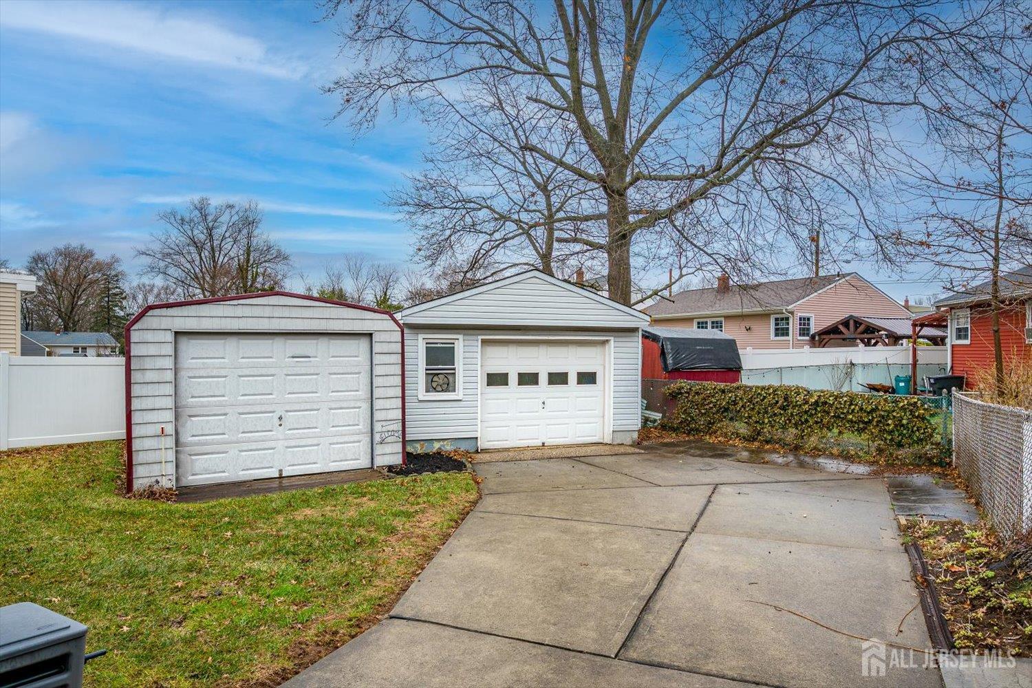 65 Rose Street Edison, NJ 08817 - Photo 29 of 35 a front view of a house with a yard and garage