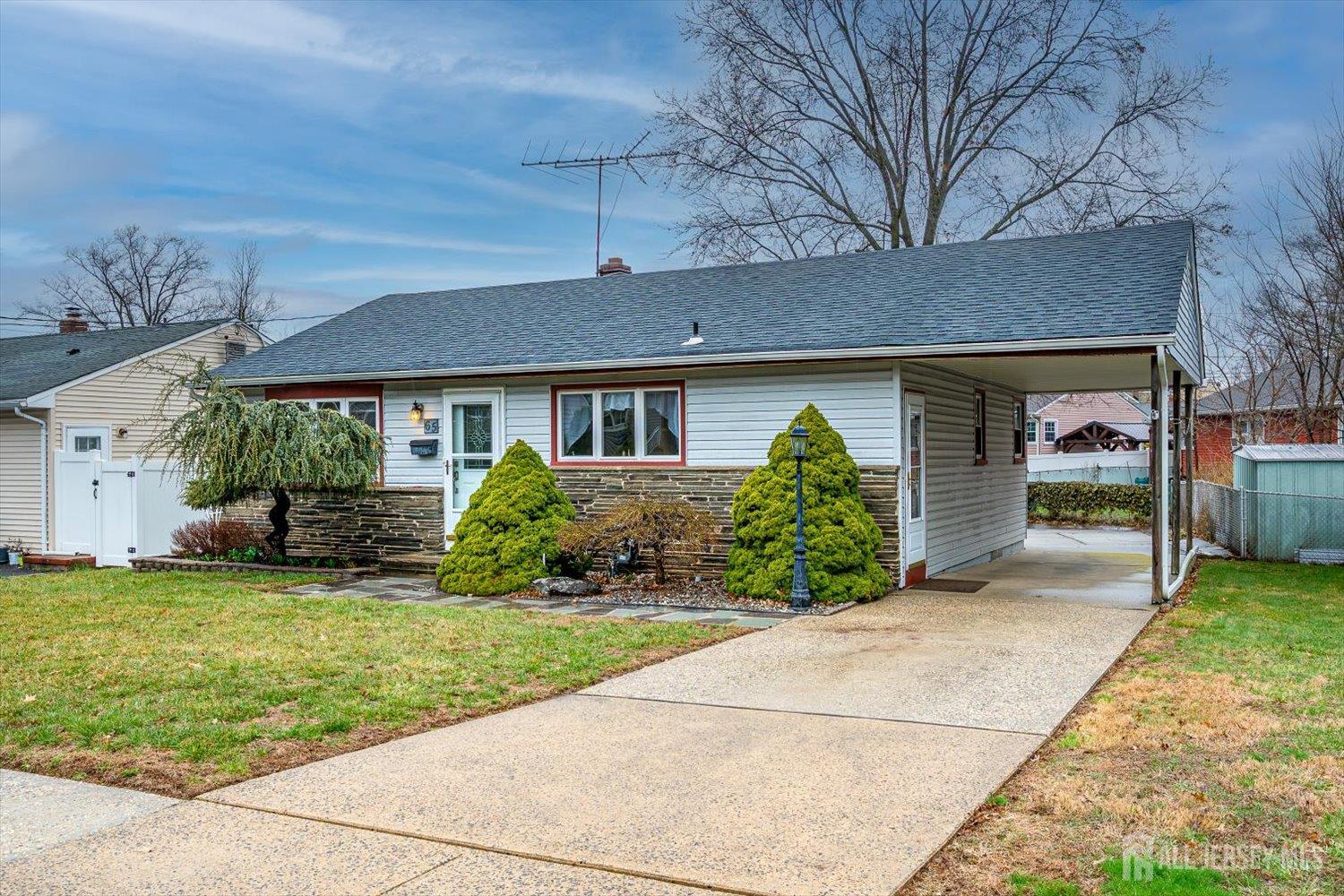 65 Rose Street Edison, NJ 08817 - Photo 3 of 35 a front view of a house with a yard