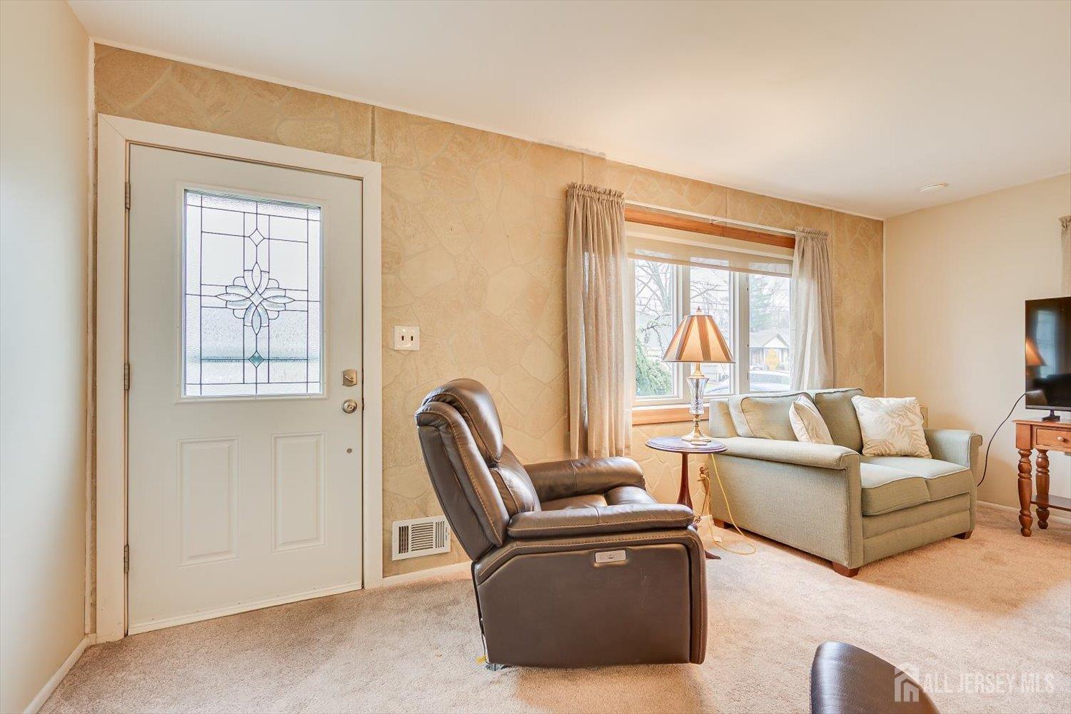 65 Rose Street Edison, NJ 08817 - Photo 8 of 35 a living room with furniture and a window