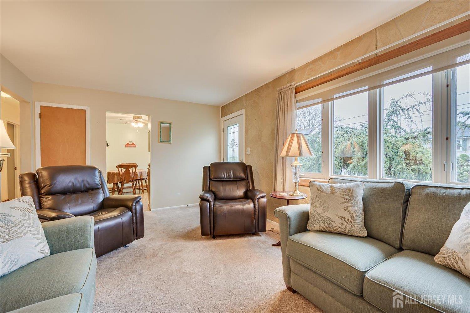 65 Rose Street Edison, NJ 08817 - Photo 9 of 35 a living room with furniture and a large window