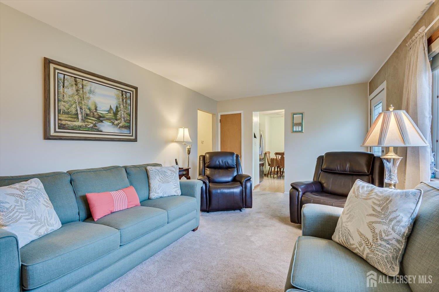 65 Rose Street Edison, NJ 08817 - Photo 10 of 35 a living room with furniture and a couch