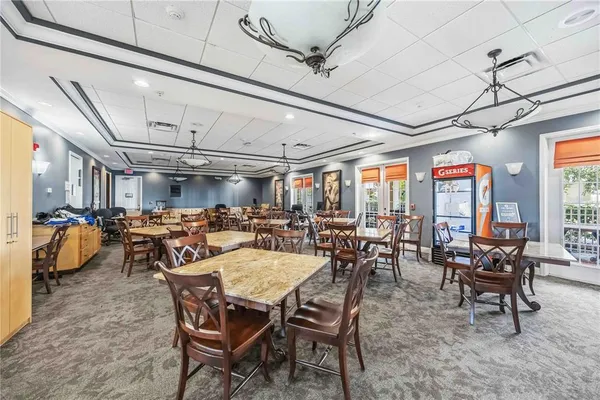 a view of a dining room with furniture window and outside view