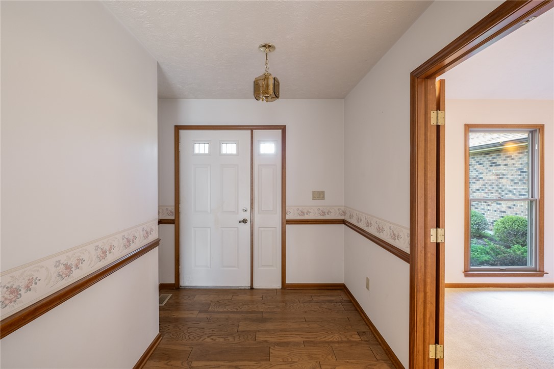 276 South Fairfield Road Bellbrook, OH 45305 - Photo 2 of 38 This entry hall features hardwood flooring and natural light, creating a welcoming first impression.